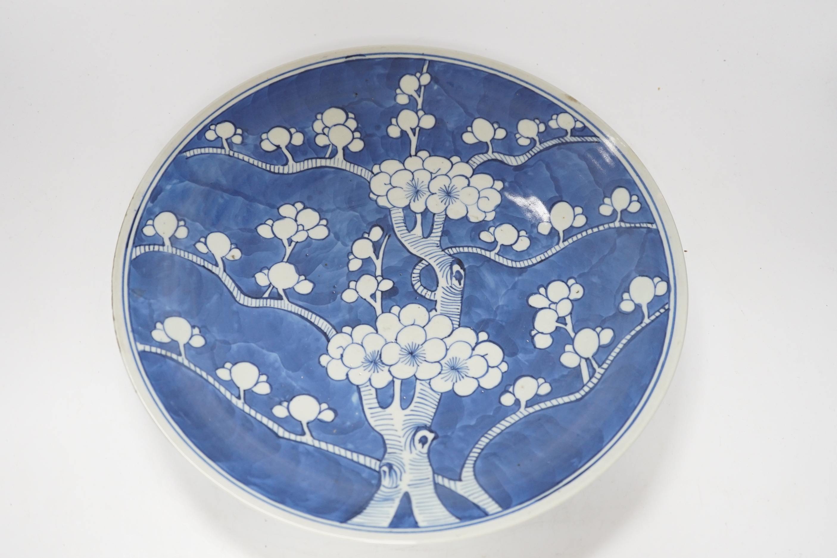 A 19th century Chinese blue and white Prunus dish, 33cm diameter